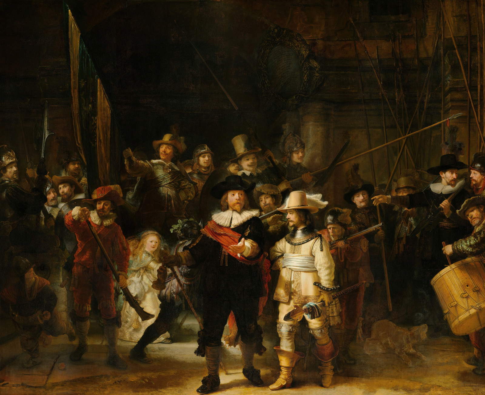 A monumental Baroque oil painting featuring a large group of Dutch civic guardsmen emerging from a dark, shadowed archway into a burst of dramatic light. At the center, Captain Frans Banninck Cocq, dressed in black with a red sash, gestures forward while speaking to Lieutenant Willem van Ruytenburch, who wears ornate yellow-gold attire. To the left, a young girl in a glowing gold dress, with a dead chicken hanging from her belt, acts as a symbolic mascot. The scene is filled with kinetic energy, featuring men holding pikes, muskets, and a large unfurled flag against a backdrop of complex architectural shadows.