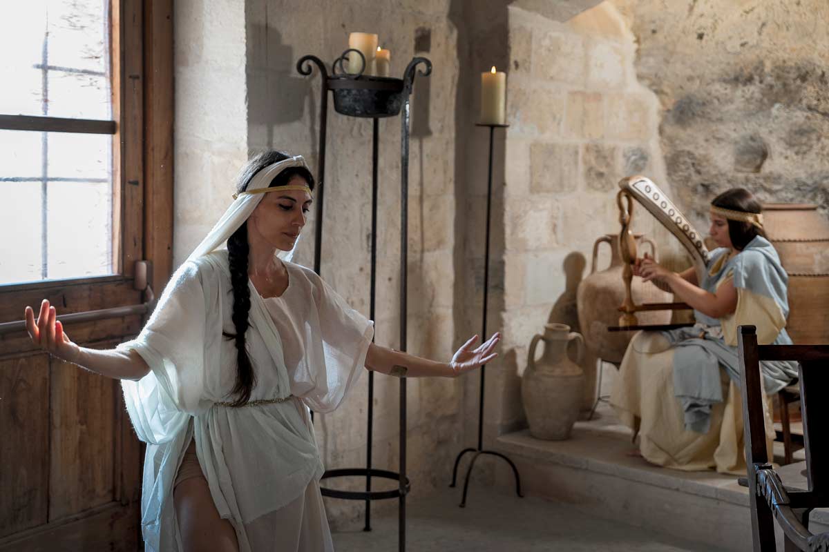 woman in ancient Greek atire moving