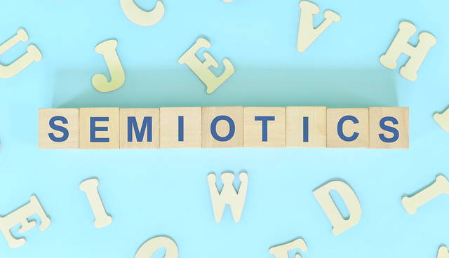 Wooden blocks spelling the word "SEMIOTICS"