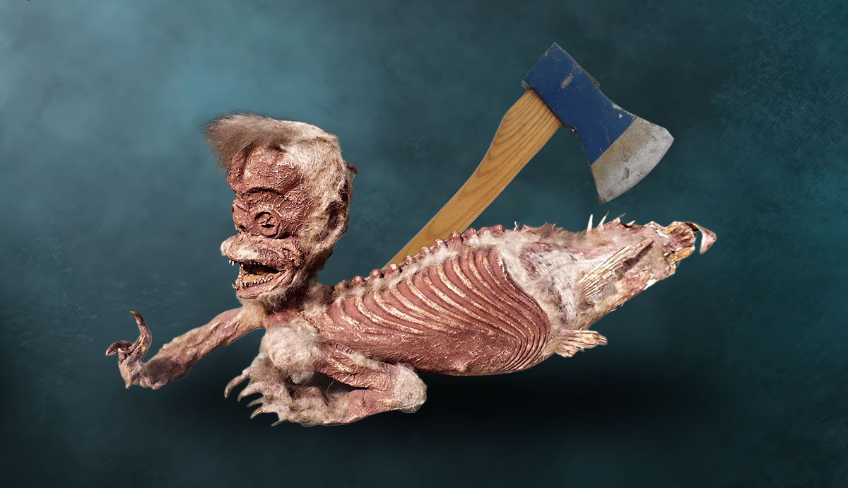 Mummified Fiji mermaid taxidermy with an axe in the background