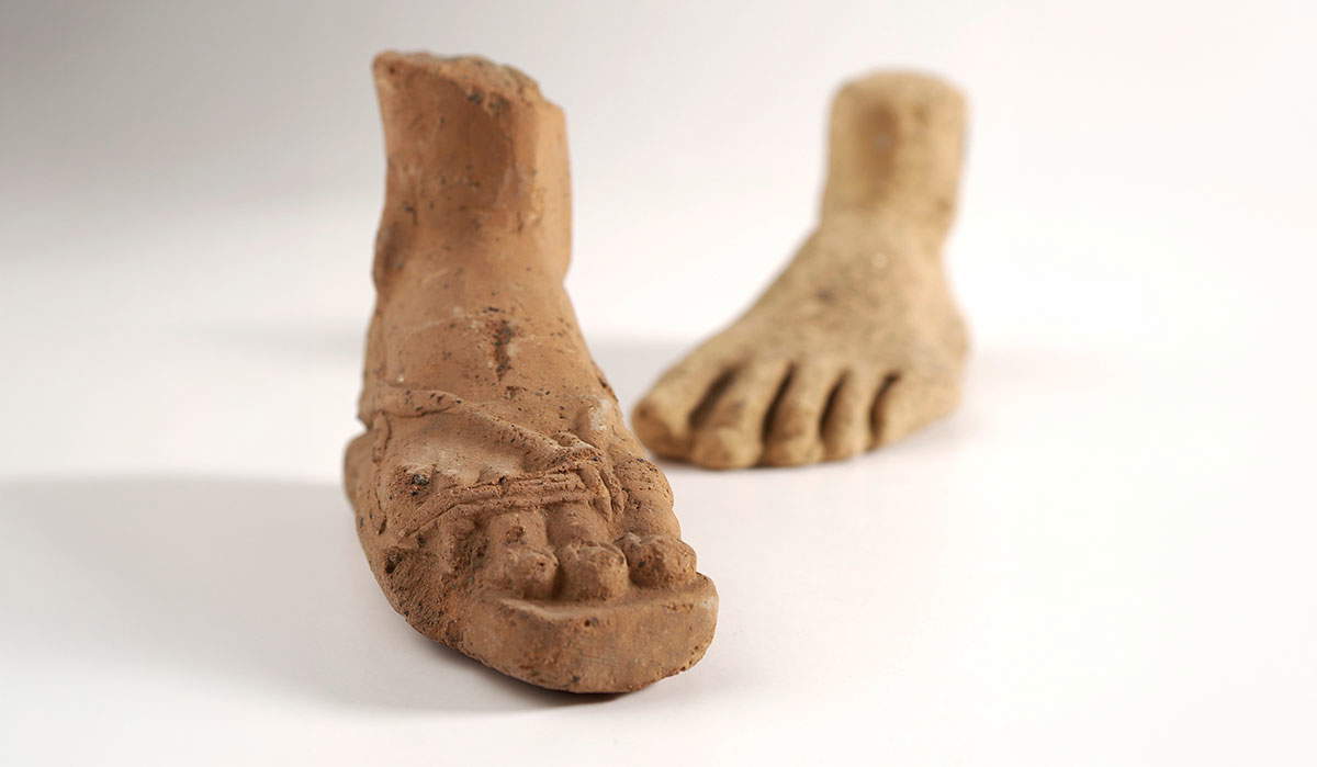 clay feet ancient statue
