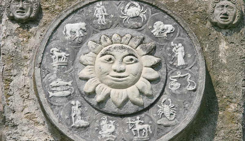 Stone sundial showing the zodiac signs