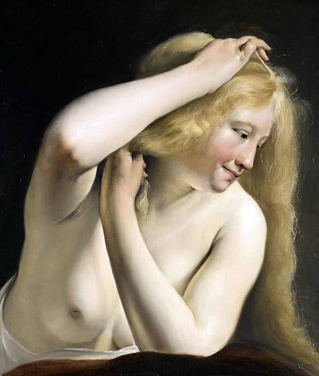 young woman combing hair