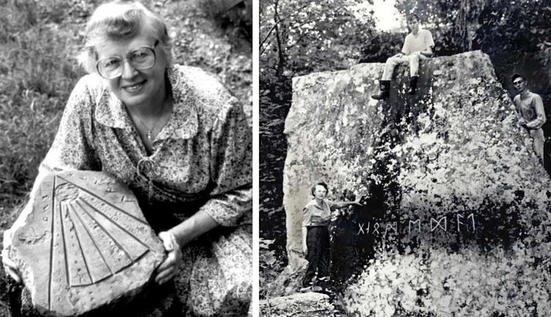 Woman holding carved stone next to runic rock.