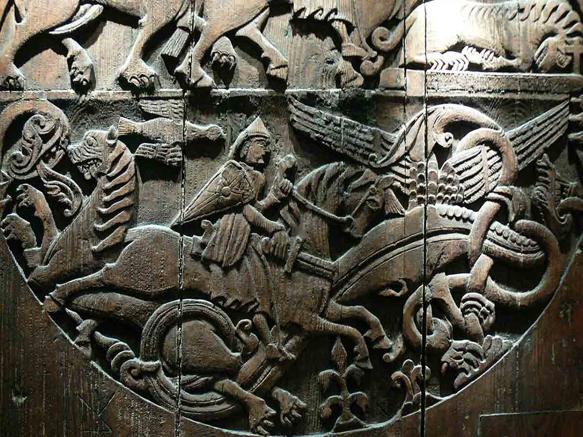 knight slaying dragon carving