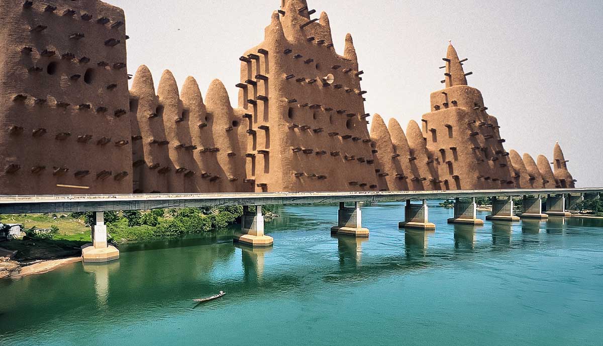 Traditional mud built structure along a river