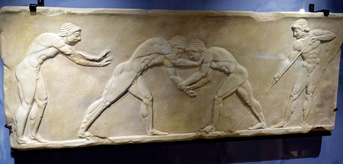 youths wrestling themistoclean wall