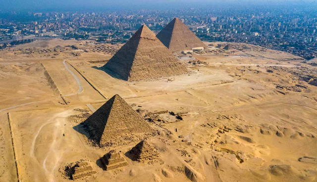 Aerial view of Giza pyramids and Cairo cityscape