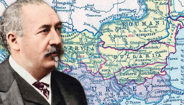 Man next to a historical map of the Balkans.