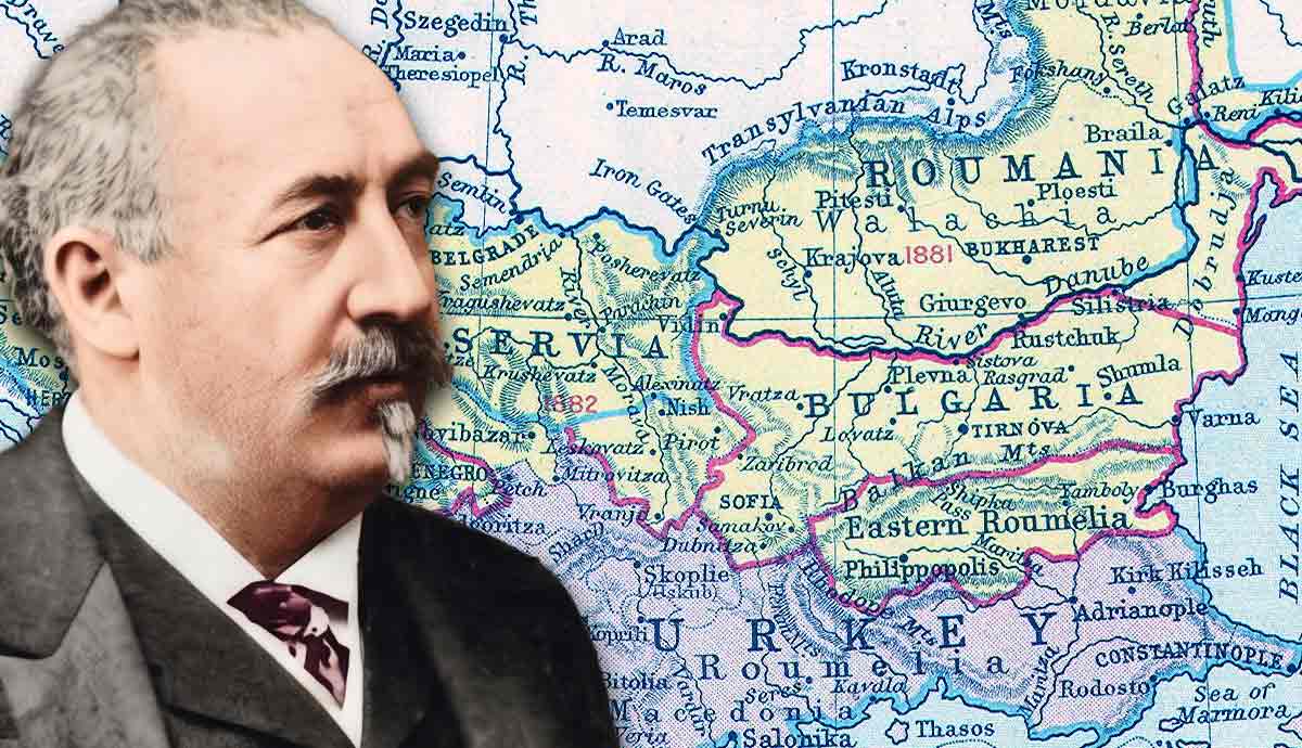 Man next to a historical map of the Balkans.