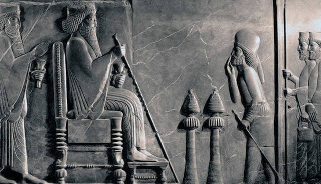 Ancient Persian relief depicting a seated king receiving officials