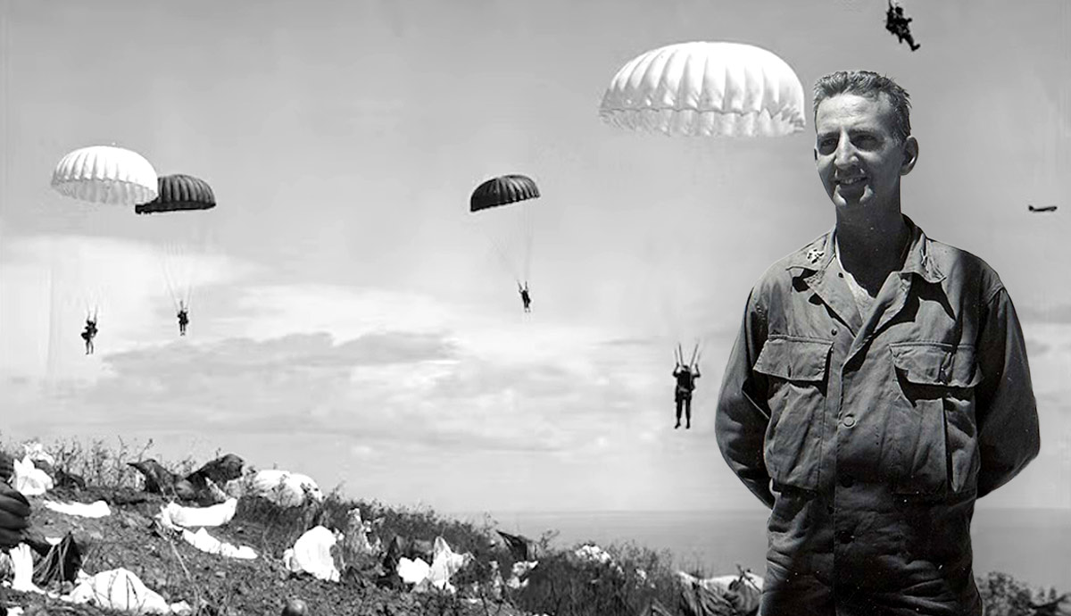 Lieutenant smiles as paratroopers land behind him.