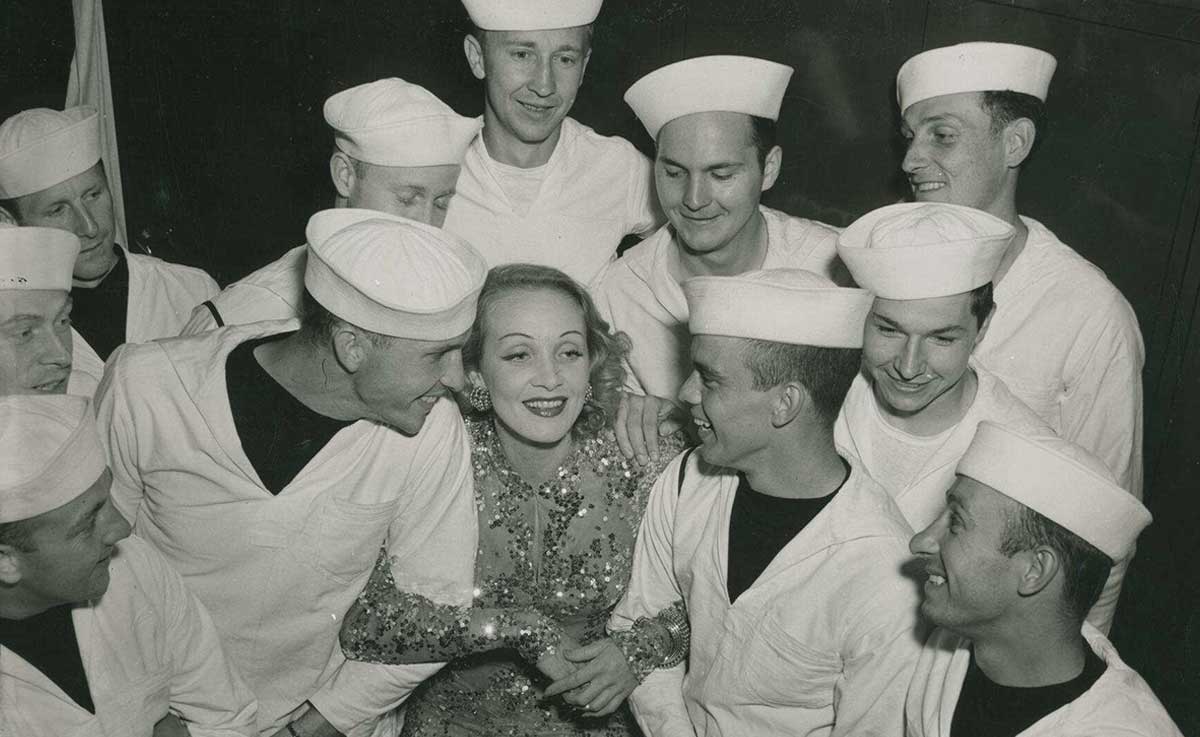 marlene dietrich sequined dress surrounded by us sailors