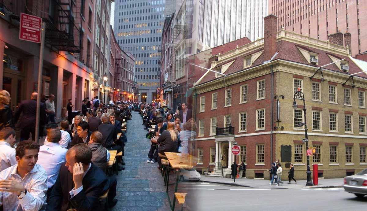 People dining on Stone Street next to Fraunces Tavern