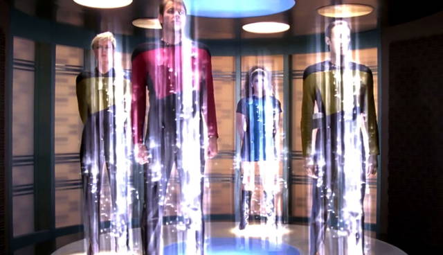 Star Trek characters beaming in a transporter room.