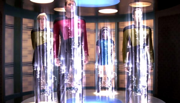 Star Trek characters beaming in a transporter room.