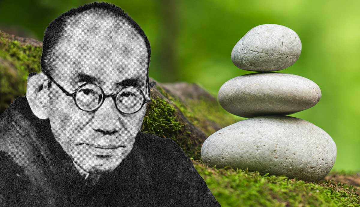 Nishida Kitaro next to stacked Zen stones.