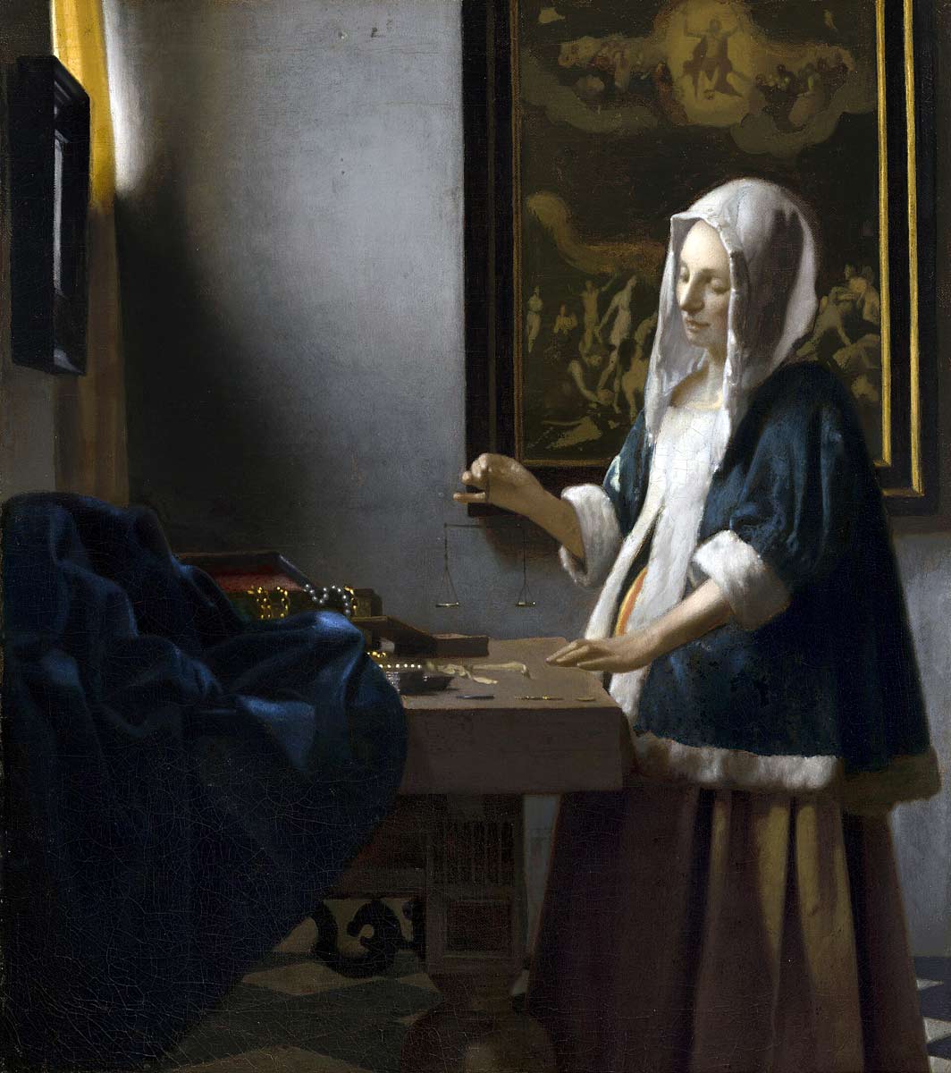 woman holding balance painting vermeer